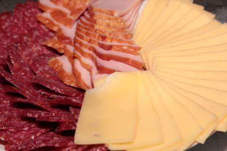 Pieces of sausage and cheese as an element of food