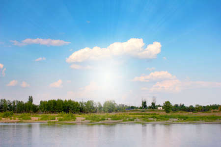 beautiful blue sunny sky and the surface of the riverの写真素材