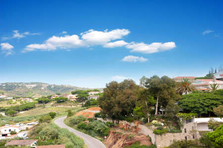 beautiful mountain landscape with meadow and sunny skyの写真素材