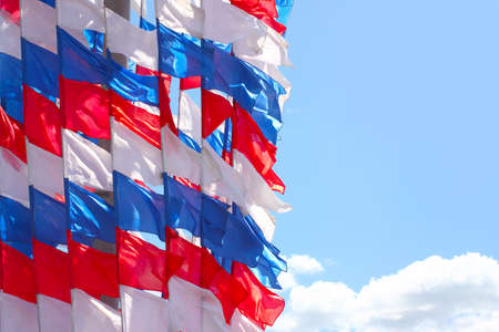 pennant in the colors of the Russian flag and the sunny skyの写真素材