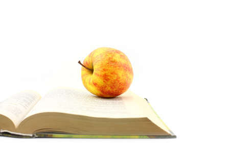 Lovely fresh ripe apple and book pagesの写真素材
