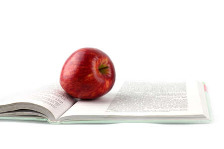 Lovely fresh ripe apple and book pagesの写真素材