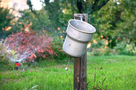 Old garden washbasin to wash your hands after workの写真素材