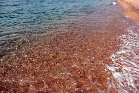 waves of the sea and the beachの写真素材