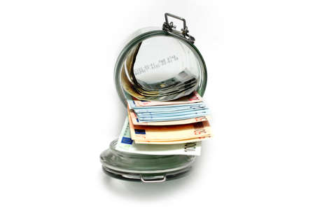 Euro paper notes in a glass jar accumulationの写真素材