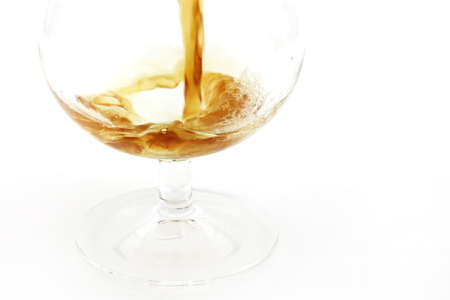 patterns pours a drink into a glass of wine
