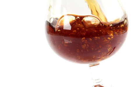 abstract patterns pours a drink into a glass of wineの写真素材