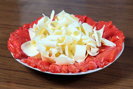 slices of delicious salmon and butter on a plateの写真素材