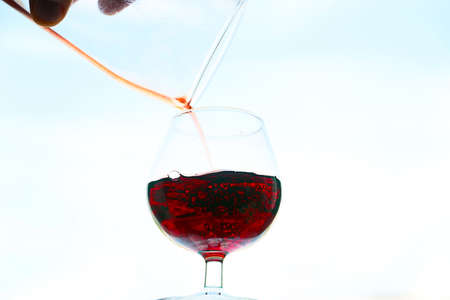 image of the current in a glass of red wineの写真素材