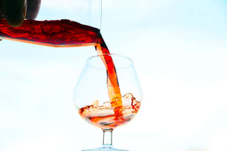 image of the current in a glass of red wineの写真素材
