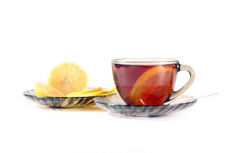 a strong black tea with a slice of lemonの写真素材