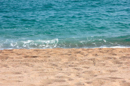coastline with sandy beach and sea wavesの写真素材