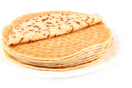 small stack of freshly baked ruddy delicious pancakes on a plateの写真素材