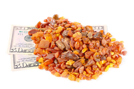 precious mineral amber and some dollars banknotes as paymentの写真素材