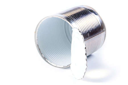 empty galvanized metal tin open with the help of a can openerの写真素材