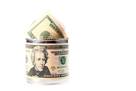 dollar banknotes in the form of a label on a tin galvanized iron with a pack of currency as an element of saving moneyの写真素材