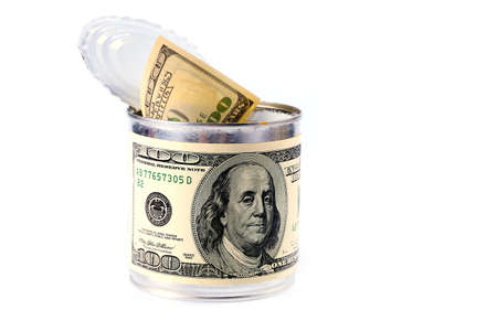 dollar banknotes in the form of a label on a tin galvanized iron with a pack of currency as an element of saving moneyの写真素材