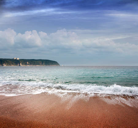 beautiful seascape with sandy beach and the sky with cloudsの写真素材