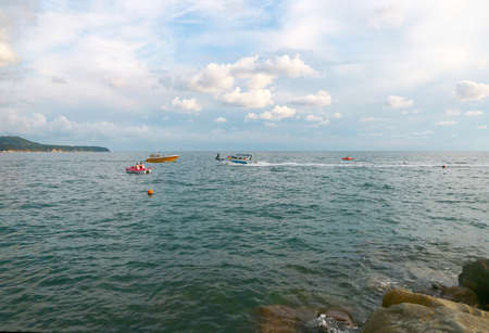 surface with waves and beautiful heavenly landscape with clouds and sunny skyのeditorial素材