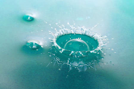 Beautiful patterns on the surface of the liquid after a dropの写真素材