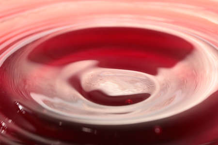 Drops of liquid form on the surfaceの写真素材