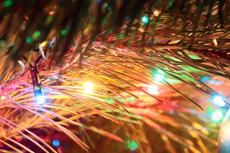 Festively decorated New Year tree with lighting and glass toysの写真素材