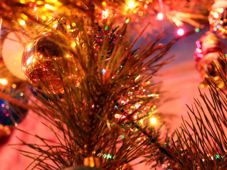 Festively decorated New Year tree with lighting and glass toysの写真素材