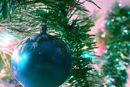 Festively decorated New Year tree with lighting and glass toysの写真素材