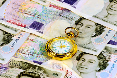 British paper national currency and antique clock as an element of luxury and successの写真素材