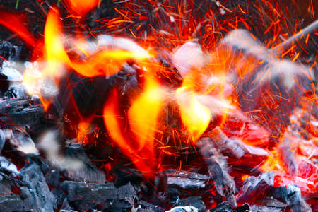 Bright fire and charcoal during a flame in the open air