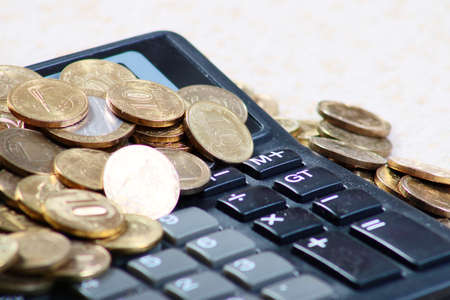 Metallic Russian coins gold ruble and calculator for calculating dividendsの写真素材