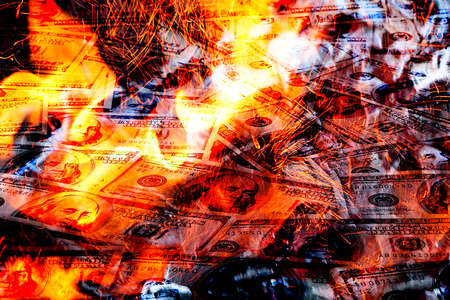 Paper money American dollar bills in bright fire as an illustration of the financial crisis