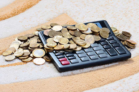 Metallic Russian coins gold ruble and calculator for countingの写真素材