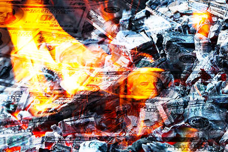 Paper money American dollar bills in bright fire as an illustration of the financial crisisの写真素材