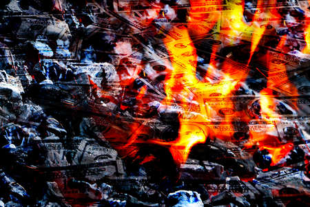 Paper money American dollar bills in bright fire as an illustration of the financial crisisの写真素材