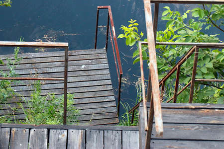 The texture and structure of the wooden steps of the ladder on the metal frameの写真素材