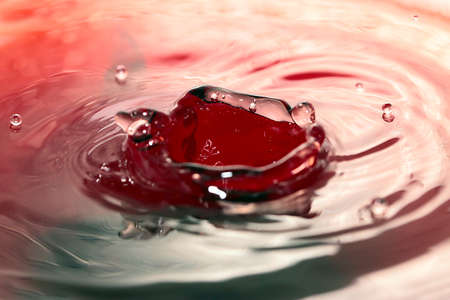 A variety of patterns on the surface of the liquid after a drop of waterの写真素材