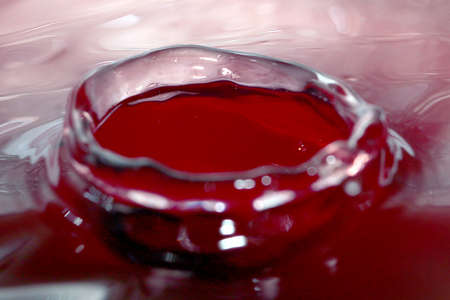 A variety of patterns on the surface of the liquid after a drop of waterの写真素材