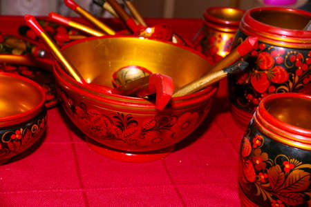 beautifully decorated wooden spoons and plates for eatの写真素材