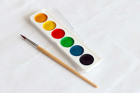 a set of watercolors and a brush for artistic creativityの写真素材