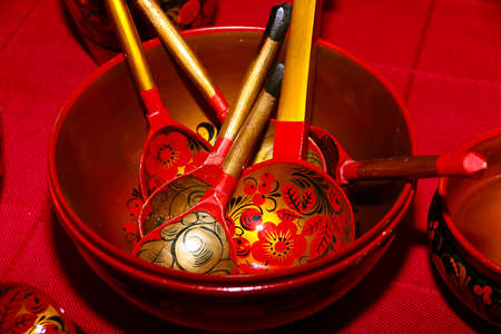 beautifully decorated wooden spoons and plates for eatの写真素材