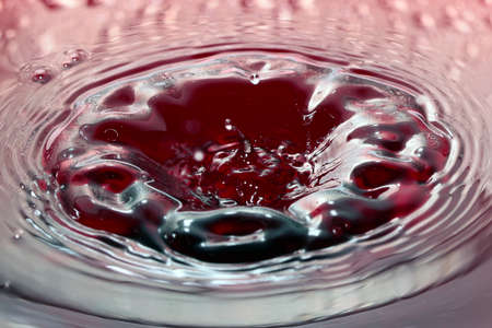 various patterns and traces of a drop on the surface of a liquidの写真素材