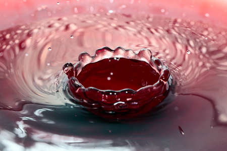 various patterns and traces of a drop on the surface of a liquidの写真素材