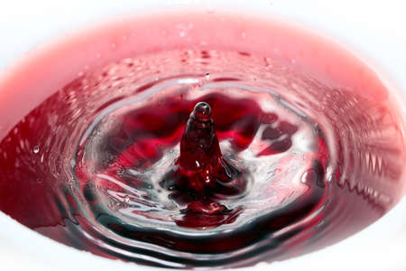 various patterns and traces of a drop on the surface of a liquidの写真素材