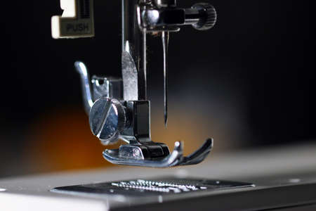 needle in the knot of an industrial sewing machineの写真素材