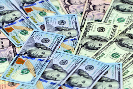 a pile of American paper dollars as part of the global economy