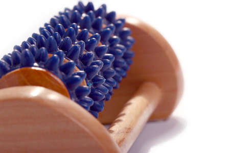 wooden massager with plastic rings for foot careの写真素材