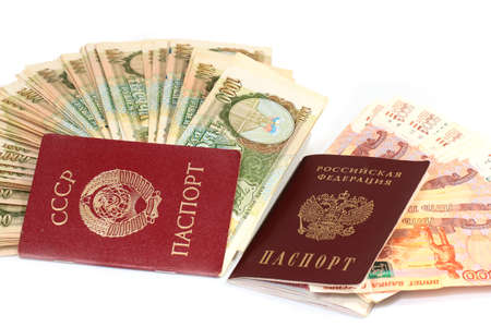 Passport of a citizen of the USSR and a passport of a modern Russian citizen with paper denominations of rubles of the corresponding timeの写真素材