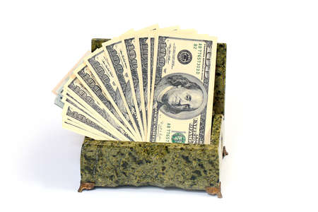 pile of paper American dollar bills in malachite casketの写真素材