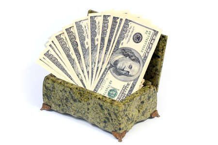 pile of paper American dollar bills in malachite casketの写真素材